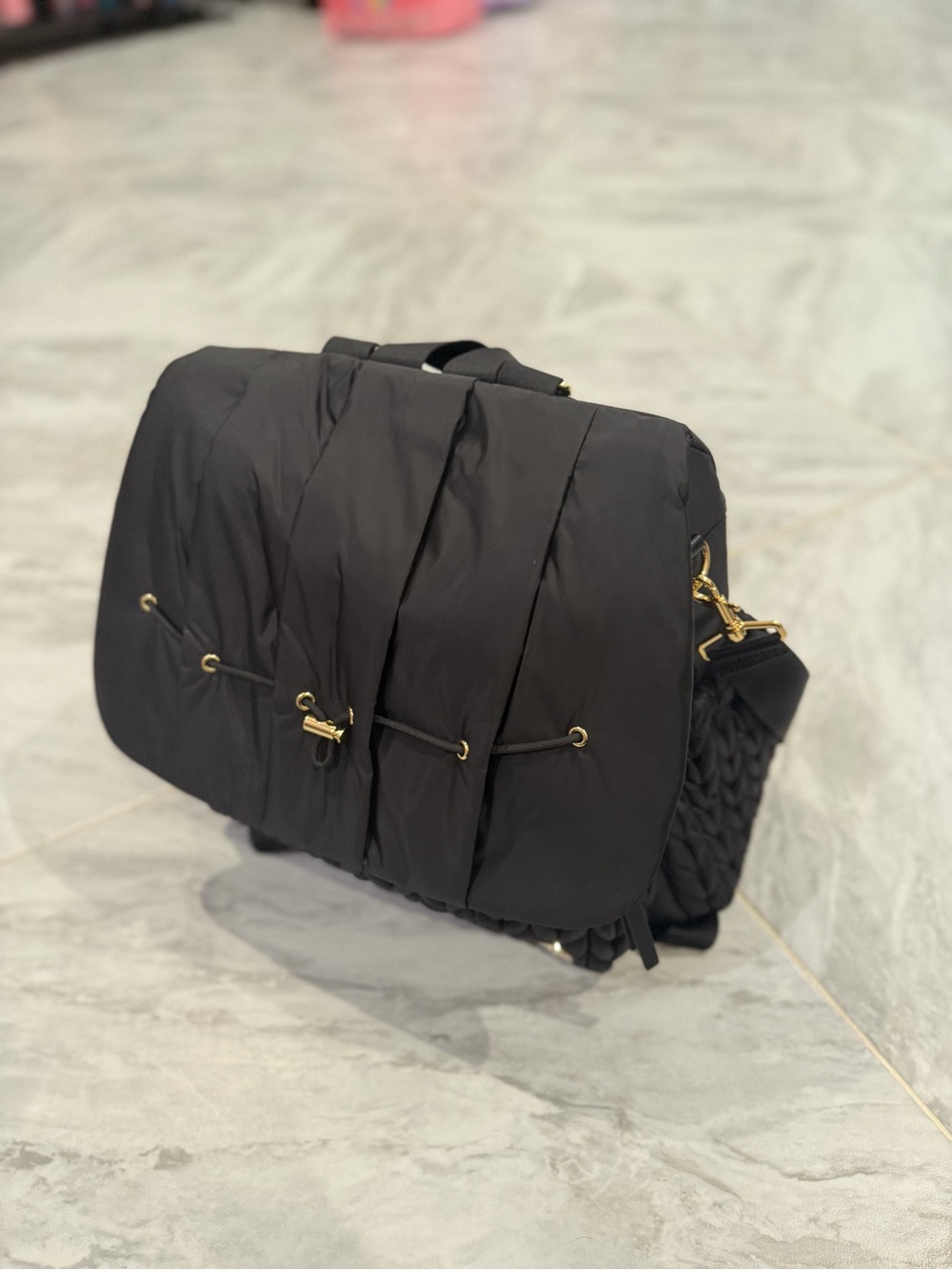 Elegant Black Quilted Shoulder Bag with Gold Accents